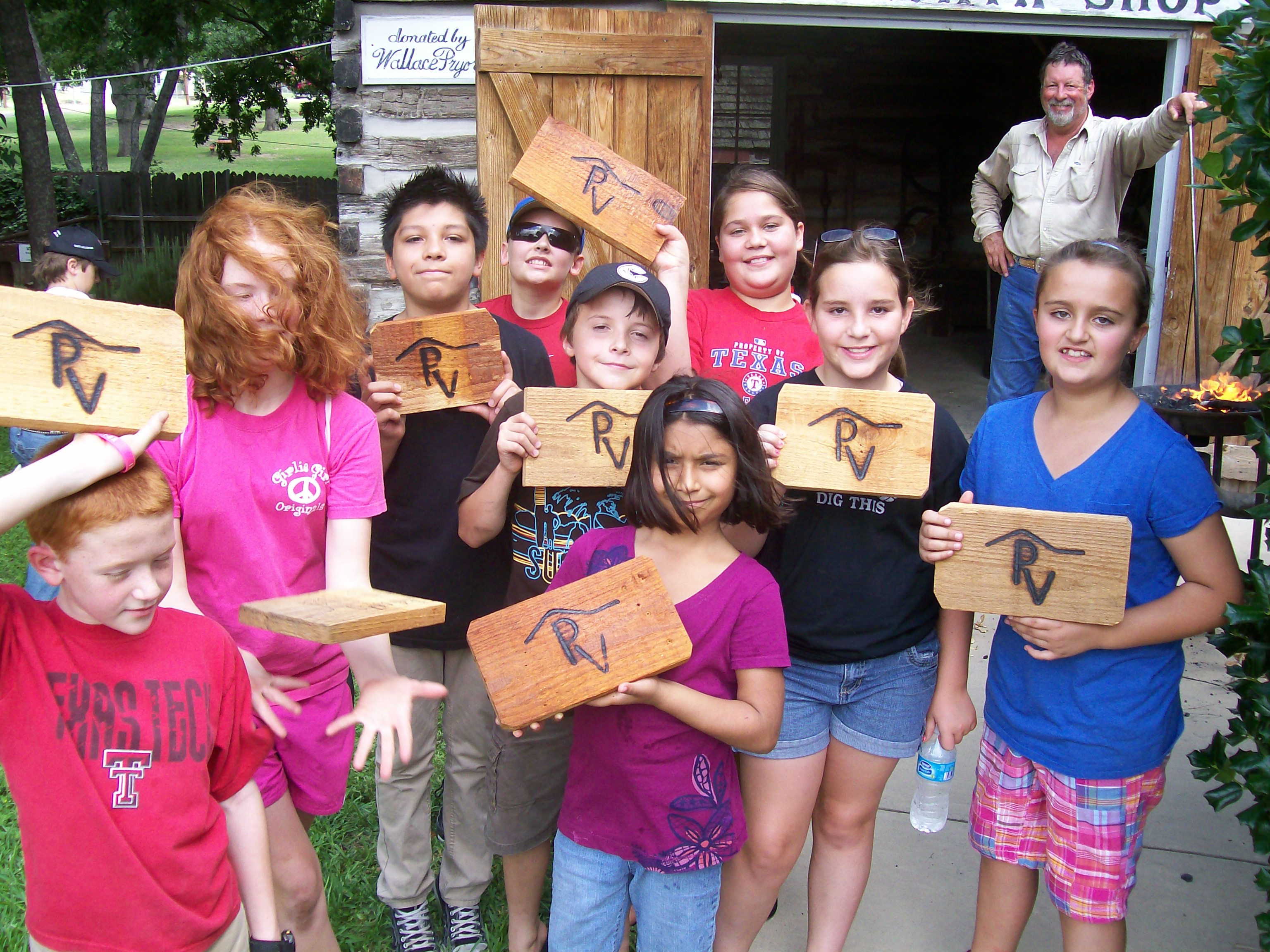 Summer Programs kids with PV wooden signs