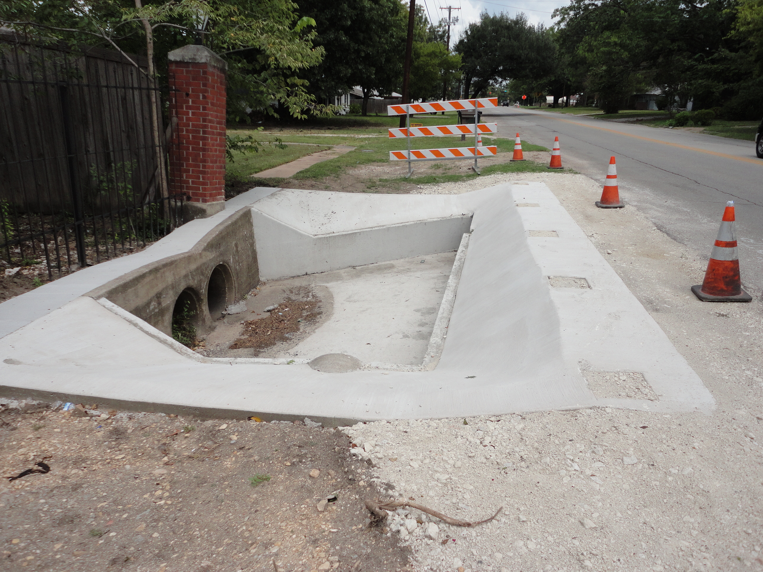 New cement around street drain